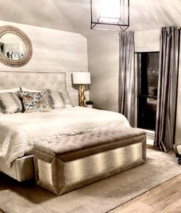 Accent wall with wood paneling, textured surface in bedroom