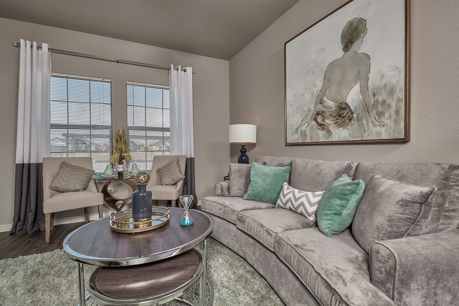 Redesigned living room combining existing furniture with new furnishings and décor.